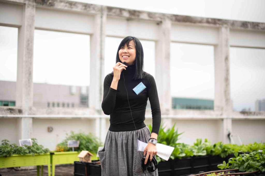 Hong Kong event photography with a woman speaking with a mic