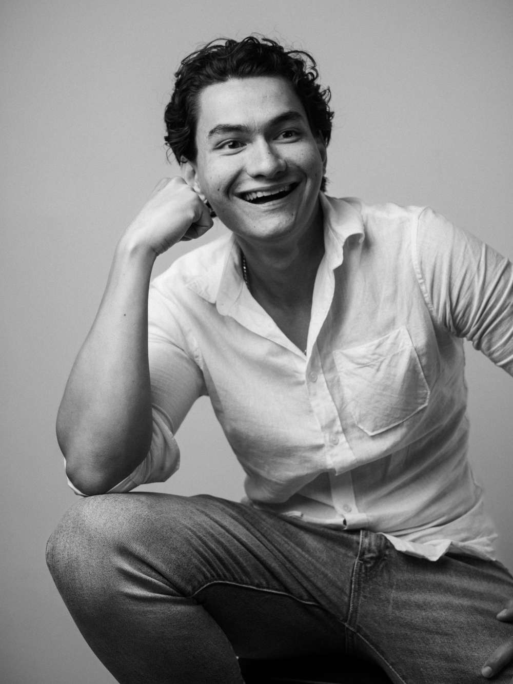 Black and white lifestyle photo of a Hong Kong male model in Hong Kong